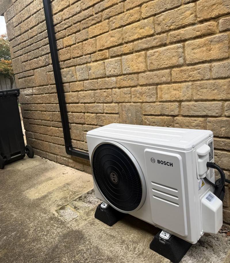 Bosch air conditioning outdoor unit on a stand, fitted by George Ayres